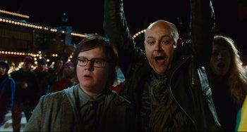 Movie still from “Hot Tub Time Machine” (2010), directed by Steve Pink – A man and a woman standing next to each other; Medium shot, Low angle