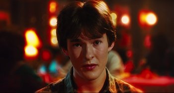 Movie still from “Hot Tub Time Machine” (2010), directed by Steve Pink – A young man with brown hair is looking at the camera; Close Up shot, High angle