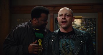 Movie still from “Hot Tub Time Machine” (2010), directed by Steve Pink – A man in a leather jacket is standing next to another man in a leather jacket; Medium shot, Over the shoulder angle