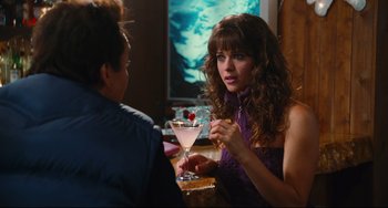 Movie still from “Hot Tub Time Machine” (2010), directed by Steve Pink – A woman sitting next to a man at a bar; Medium shot, Over the shoulder angle