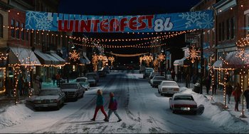 Movie still from “Hot Tub Time Machine” (2010), directed by Steve Pink – Two people cross a street in the snow at night; Extreme Wide shot, Low angle