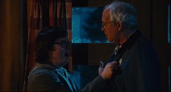 Movie still from “Hot Tub Time Machine” (2010), directed by Steve Pink – An older man and a younger woman in a room; Medium shot, Over the shoulder angle
