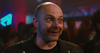 Movie still from “Hot Tub Time Machine” (2010), directed by Steve Pink – A man with a bald head looking surprised at the camera; Close Up shot, Low angle