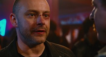 Movie still from “Hot Tub Time Machine” (2010), directed by Steve Pink – A person wearing a leather jacket; Close Up shot, Low angle