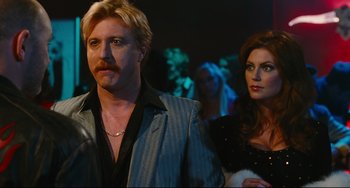 Movie still from “Hot Tub Time Machine” (2010), directed by Steve Pink – A man and a woman standing next to each other; Close Up shot, Over the shoulder angle