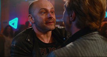 Movie still from “Hot Tub Time Machine” (2010), directed by Steve Pink – A man in a leather jacket talking to another man in a leather jacket; Close Up shot, Over the shoulder angle