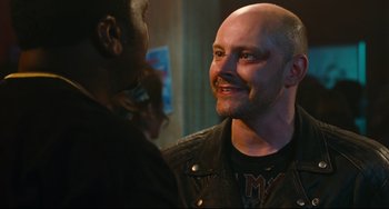 Movie still from “Hot Tub Time Machine” (2010), directed by Steve Pink – A man in a leather jacket talking to another man in a leather jacket; Close Up shot, Over the shoulder angle