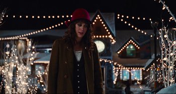 Movie still from “Hot Tub Time Machine” (2010), directed by Steve Pink – A woman wearing a red hat standing in front of lights; Medium shot, Over the shoulder angle