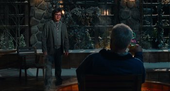 Movie still from “Hot Tub Time Machine” (2010), directed by Steve Pink – A man standing in front of another man in front of a stone wall; Wide shot, Over the shoulder angle