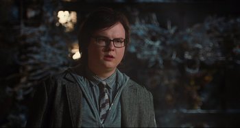 Movie still from “Hot Tub Time Machine” (2010), directed by Steve Pink – A person wearing glasses and a jacket; Close Up shot, Over the shoulder angle