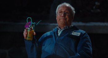 Movie still from “Hot Tub Time Machine” (2010), directed by Steve Pink – An older man holding a drink in his hand; Medium shot, Over the shoulder angle