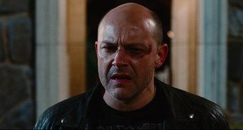 Movie still from “Hot Tub Time Machine” (2010), directed by Steve Pink – A man with a shaved head is crying; Close Up shot, Low angle