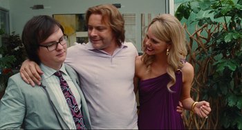 Movie still from “Hot Tub Time Machine” (2010), directed by Steve Pink – A man and two women standing next to each other; Medium shot, Over the shoulder angle