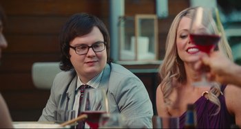 Movie still from “Hot Tub Time Machine” (2010), directed by Steve Pink – A man and a woman sitting at a dinner table; Medium shot, Over the shoulder angle