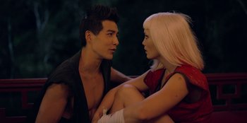 Movie still from “Black Mirror” (2011), created by Charlie Brooker – A man and a woman sitting next to each other; Close Up shot, Over the shoulder angle