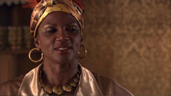 Movie still from “How High” (2001), directed by Jesse Dylan – A person wearing a head scarf; Close Up shot, Over the shoulder angle