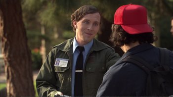 Movie still from “How High” (2001), directed by Jesse Dylan – A man in a green jacket talking to a man in a red hat; Medium shot, Over the shoulder angle