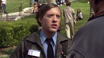 Movie still from “How High” (2001), directed by Jesse Dylan – A man in a green jacket and a blue tie; Close Up shot, Over the shoulder angle