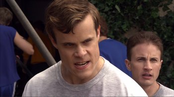 Movie still from “How High” (2001), directed by Jesse Dylan – A person wearing a white t - shirt; Close Up shot, Over the shoulder angle