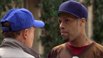 Movie still from “How High” (2001), directed by Jesse Dylan – Two men talking to each other in front of a building; Close Up shot, Over the shoulder angle