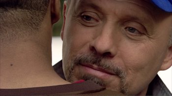 Movie still from “How High” (2001), directed by Jesse Dylan – A person with a beard and mustache; Close Up shot, Over the shoulder angle