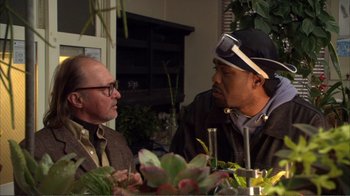 Movie still from “How High” (2001), directed by Jesse Dylan – Two men sitting at a table talking to each other; Medium shot, Over the shoulder angle