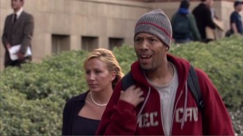 Movie still from “How High” (2001), directed by Jesse Dylan – A man and a woman walking down a street; Medium shot, Over the shoulder angle