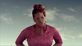 Movie still from “How High” (2001), directed by Jesse Dylan – A woman in a pink shirt and a red bow tie; Close Up shot, Low angle