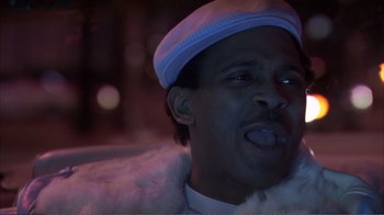 Movie still from “How High” (2001), directed by Jesse Dylan – A person wearing a white hat; Close Up shot, Low angle