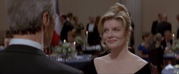 Movie still from “In the Line of Fire” (1993), directed by Wolfgang Petersen – A person wearing a dress; Close Up shot, Over the shoulder angle