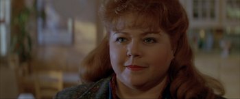 Movie still from “In the Line of Fire” (1993), directed by Wolfgang Petersen – A person with a crying face; Close Up shot, Over the shoulder angle