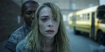 Movie still from “Black Summer” (2019), created by John Hyams – A person with wet blonde hair; Close Up shot, Over the shoulder angle