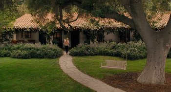 Movie still from “It's Complicated” (2009), directed by Nancy Meyers – A woman walking down a path in a garden; Extreme Wide shot, High angle