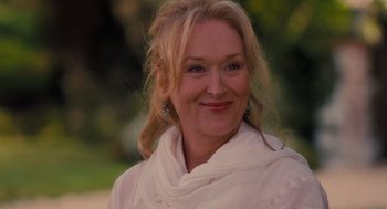 Movie still from “It's Complicated” (2009), directed by Nancy Meyers – A person wearing a white shirt; Close Up shot, Over the shoulder angle