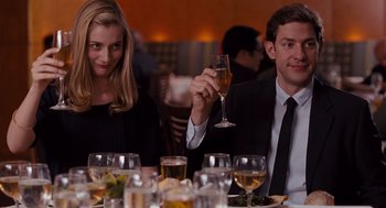 Movie still from “It's Complicated” (2009), directed by Nancy Meyers – A man and a woman sitting at a dinner table; Medium shot, Over the shoulder angle