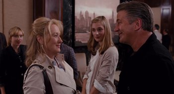 Movie still from “It's Complicated” (2009), directed by Nancy Meyers – Two women and a man are talking to each other; Medium shot, Over the shoulder angle