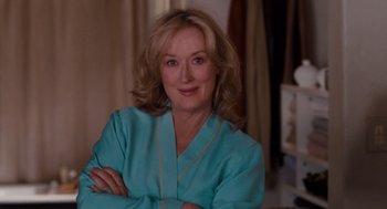 Movie still from “It's Complicated” (2009), directed by Nancy Meyers – A person wearing a blue shirt; Close Up shot, Over the shoulder angle