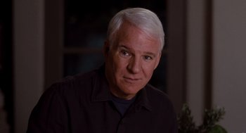 Movie still from “It's Complicated” (2009), directed by Nancy Meyers – A person wearing a black shirt; Close Up shot, Over the shoulder angle