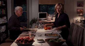 Movie still from “It's Complicated” (2009), directed by Nancy Meyers – A woman and a man preparing a meal at a table; Medium shot, High angle