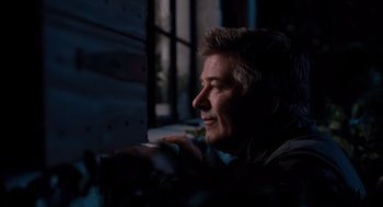 Movie still from “It's Complicated” (2009), directed by Nancy Meyers – A person looking out a window; Close Up shot, Over the shoulder angle