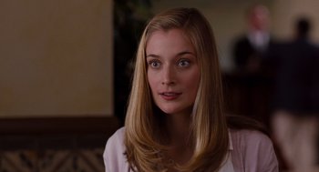 Movie still from “It's Complicated” (2009), directed by Nancy Meyers – A beautiful young woman with long blonde hair; Close Up shot, Over the shoulder angle