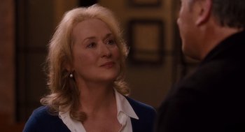 Movie still from “It's Complicated” (2009), directed by Nancy Meyers – An older woman is talking to a younger man; Close Up shot, Over the shoulder angle