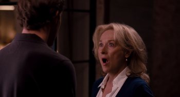 Movie still from “It's Complicated” (2009), directed by Nancy Meyers – An older woman with a surprised look on her face; Close Up shot, Over the shoulder angle