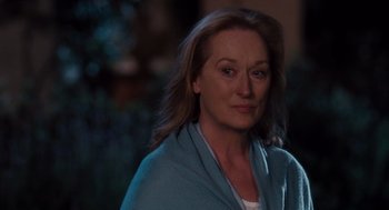 Movie still from “It's Complicated” (2009), directed by Nancy Meyers – A person wearing a blue shirt; Close Up shot, Over the shoulder angle