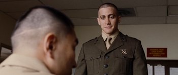 Movie still from “Jarhead” (2005), directed by Sam Mendes – A man in a uniform looking at himself in the mirror; Close Up shot, Over the shoulder angle