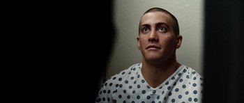 Movie still from “Jarhead” (2005), directed by Sam Mendes – A person looking up at the sky; Close Up shot, Low angle