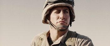 Movie still from “Jarhead” (2005), directed by Sam Mendes – A man in a military uniform wearing a helmet; Close Up shot, Low angle