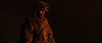 Movie still from “Jarhead” (2005), directed by Sam Mendes – A man wearing a helmet and a uniform; Close Up shot, High angle