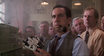 Movie still from “Jumanji” (1995), directed by Joe Johnston – A group of men standing in a room; Close Up shot, Low angle