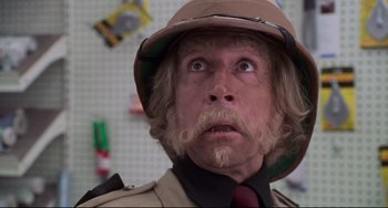 Movie still from “Jumanji” (1995), directed by Joe Johnston – A person wearing a hat; Close Up shot, Low angle